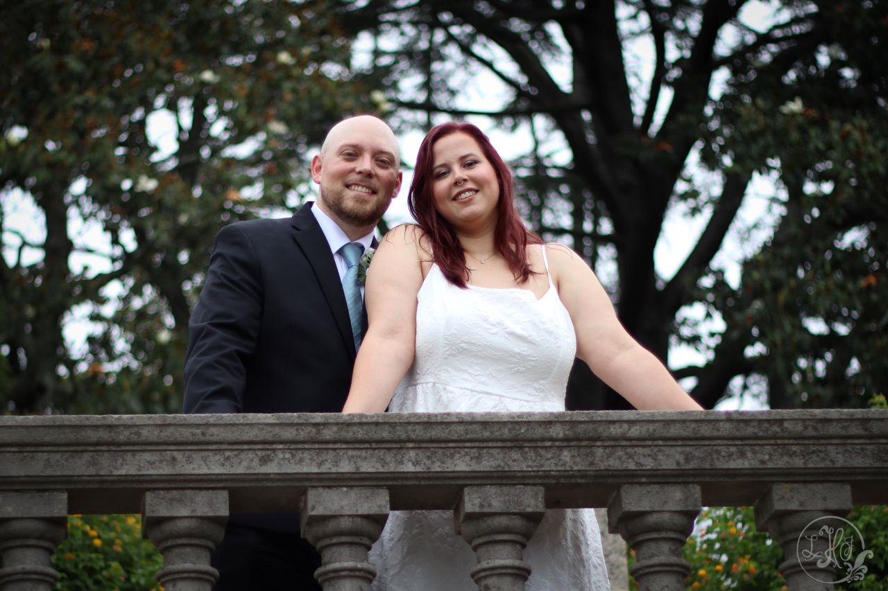 Bride and Groom portrait over stone wall