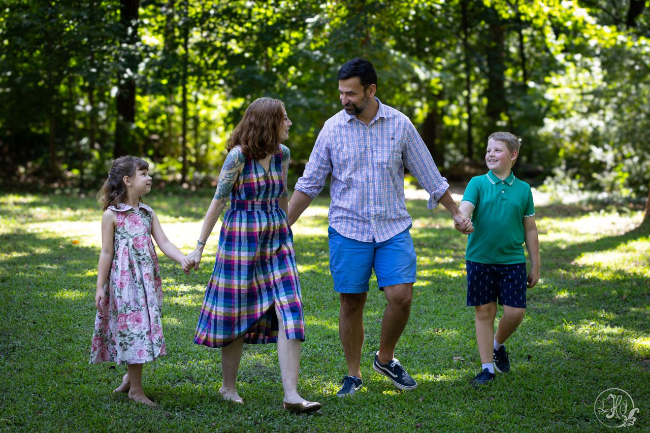 Family of 4 walking holding hands
