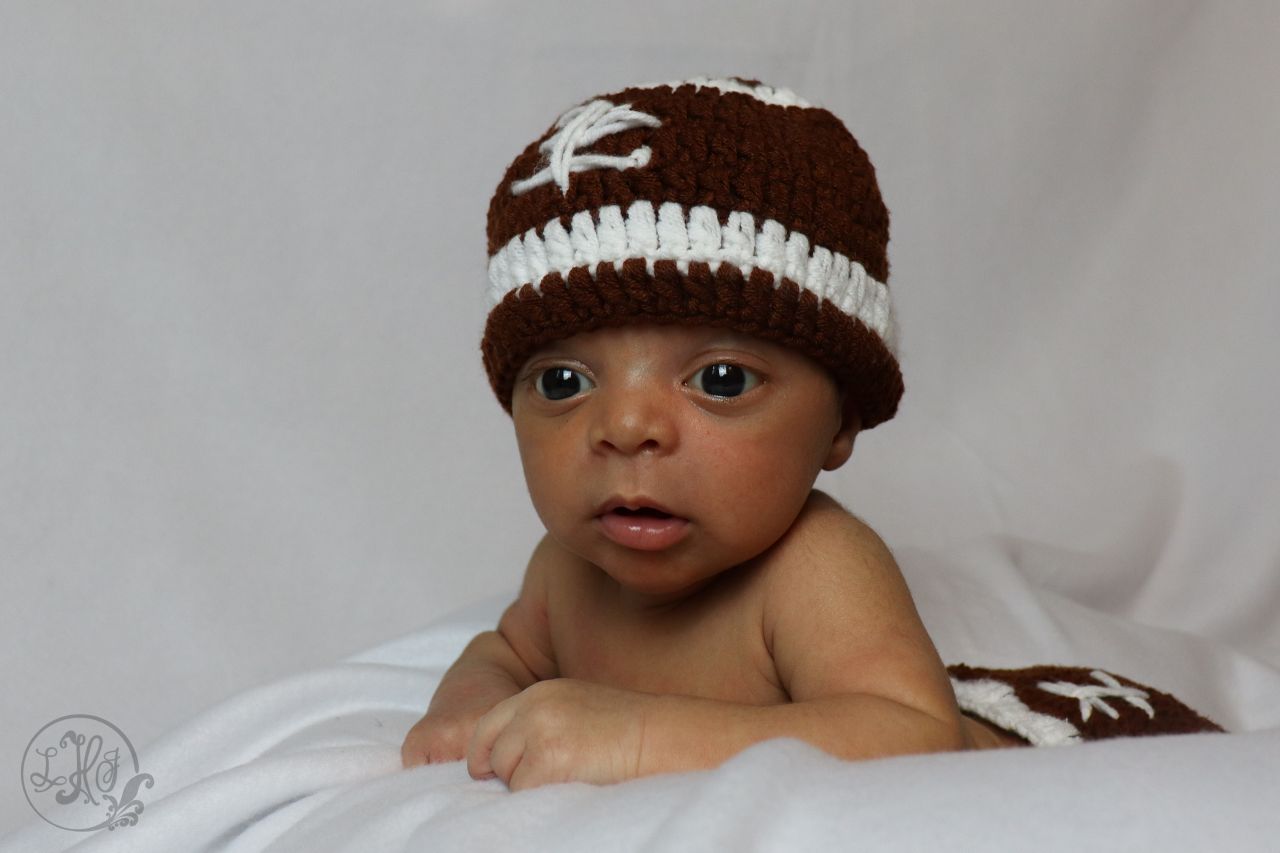Newborn Portrait-Baby in football outfit