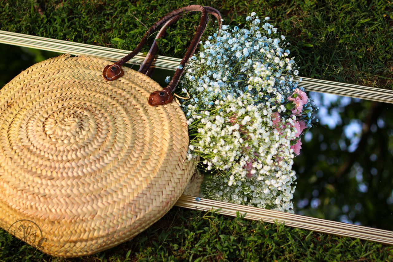 Detail photo of flowers in bag on mirror