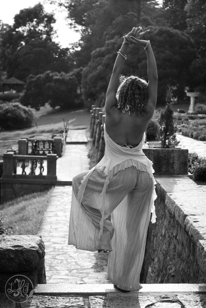 Black and white portrait of young woman in yoga pose